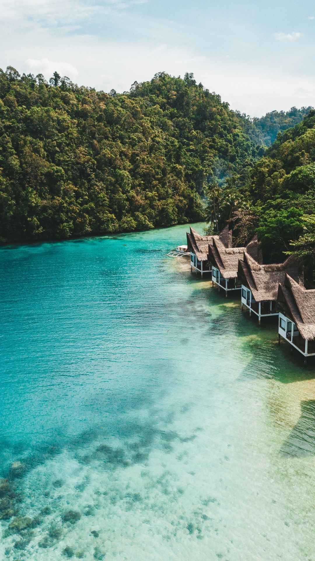 Overwater villas on turquoise ocean – inspiration for BATHEIA’s calm, ocean-inspired skincare lifestyle.